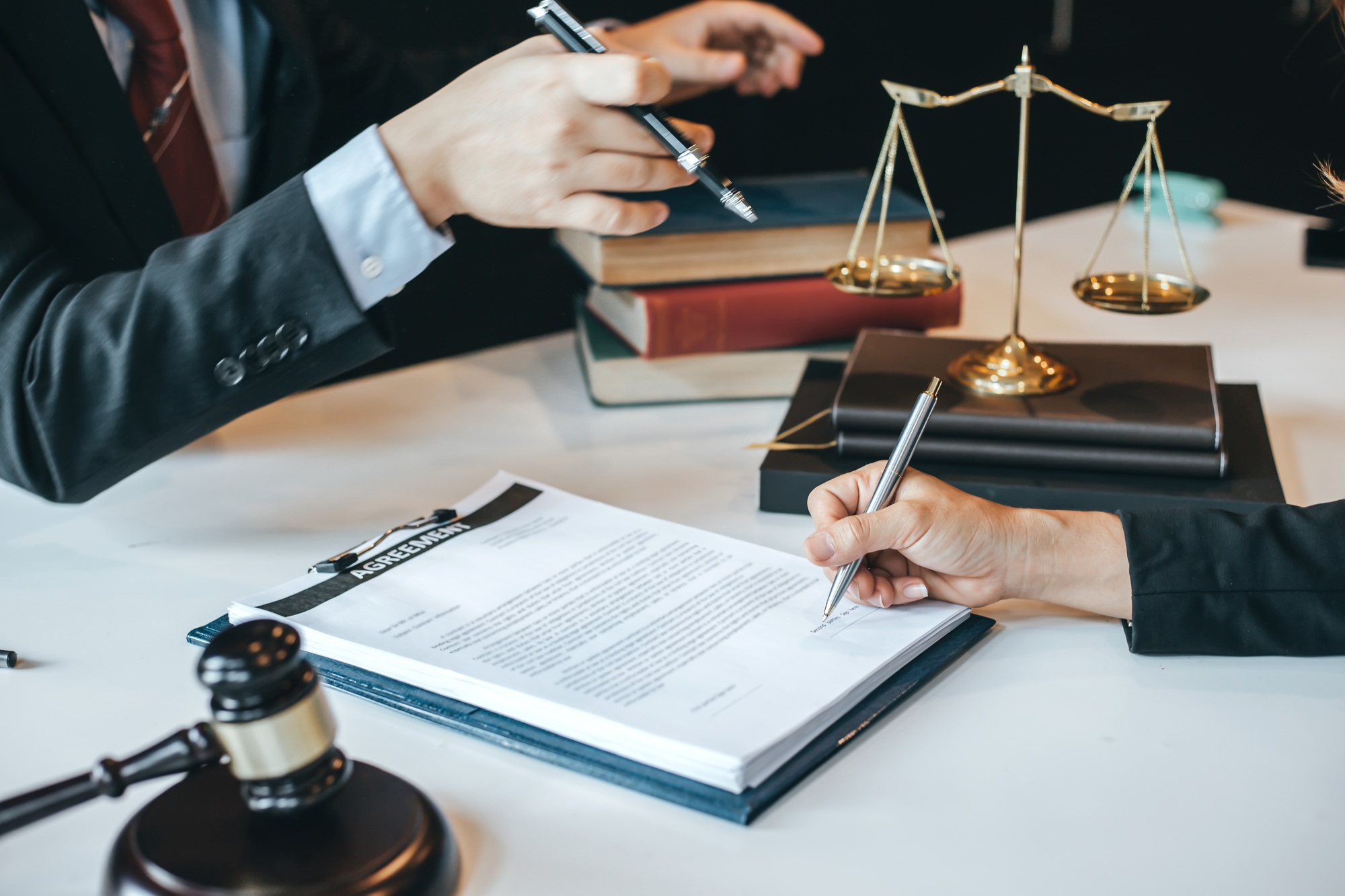 Businessman and lawyer discuss the contract document. Treaty of the law. Sign a contract business.